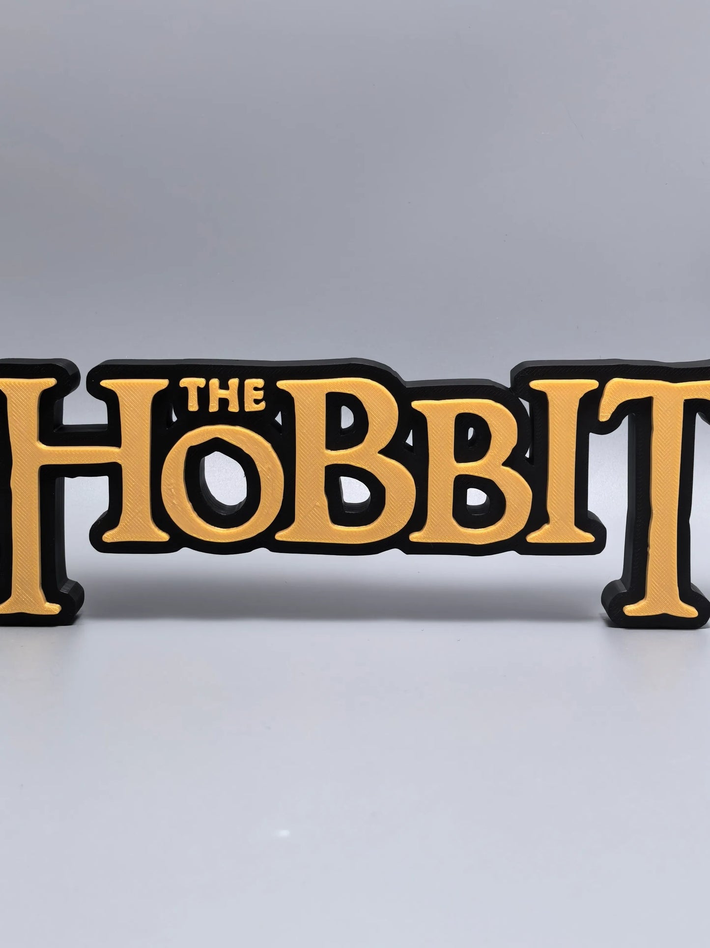 The Hobbit logo display sign front view