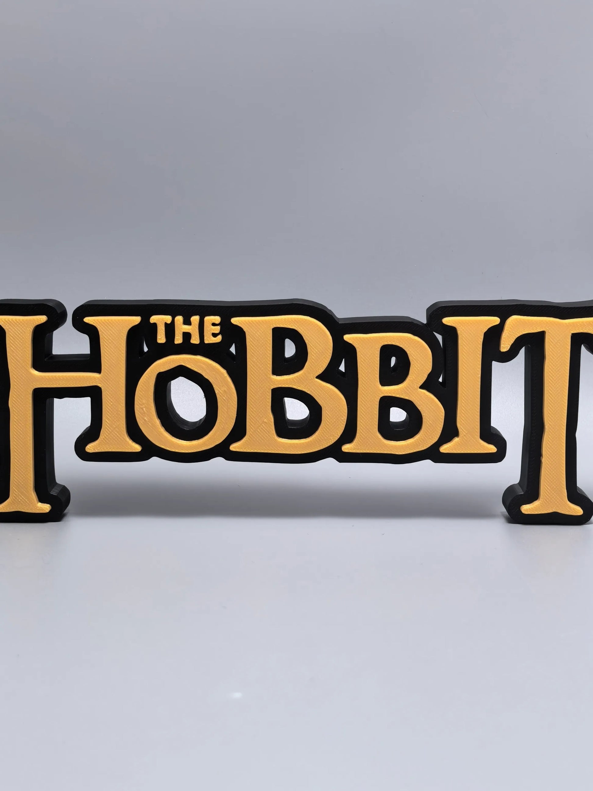 The Hobbit logo display sign front view